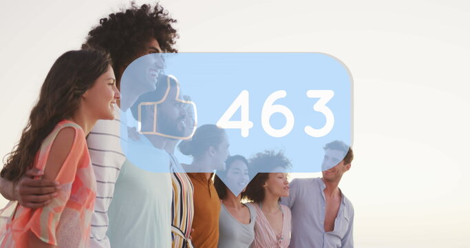 Image of speech bubble with increasing likes over diverse friends posing for a picture at beach
