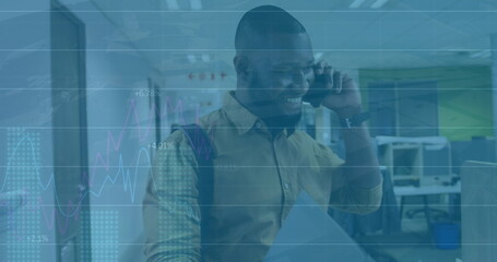 Image of financial data processing over african american businessman using smartphone