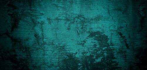  A textured background featuring a deep teal color with a distressed, grunge appearance. The surface shows variations in tone and subtle patterns, creating an abstract and moody aesthetic.
