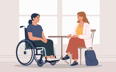 Two women having a friendly conversation, one in a wheelchair and the other seated on a stool in a cozy indoor setting
