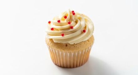 Vanilla cupcake with creamy frosting and red sprinkles on a white background