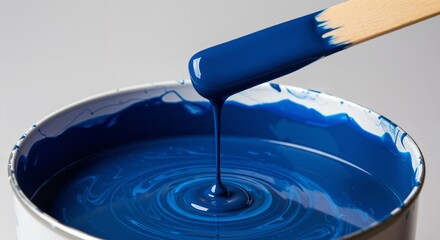 High-Quality Blue Paint in Open Can with Stirring Stick for Home Improvement Projects
