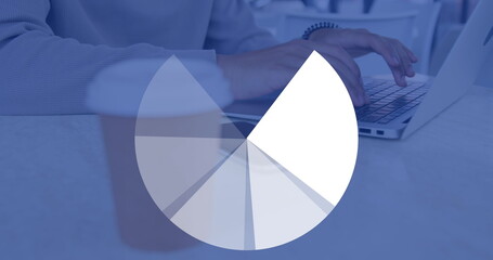 Image of round graphs over hands of caucasian man using laptop