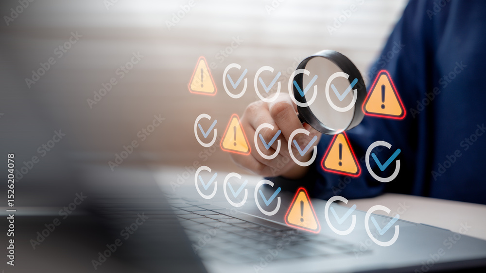 Aufkleber hand using magnifying glass to inspect warning and check icons on laptop screen, representing system