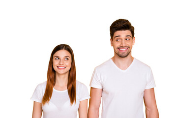 Fototapeta premium Portrait of charming buddies with long ginger foxy hair looking wearing white t-shirt isolated over yellow background