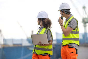 Industrial Workers Overseeing Operations at a Commercial Dock, Team of Maritime Professionals...