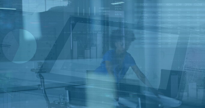 Image of financial data processing over african american businesswoman