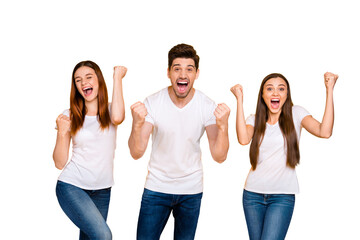 Portrait of three nice attractive lovely cheerful cheery person celebrating victory triumph having fun isolated over bright vivid shine yellow background
