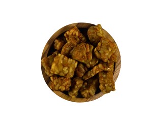 Small cube shaped fried tempeh in round teak wood bowl, isolated on white