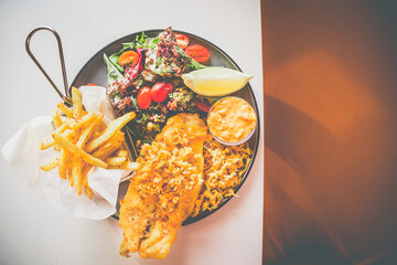 Beer Battered Snapper Fish made with crimson snapper, mesclun salad, fries