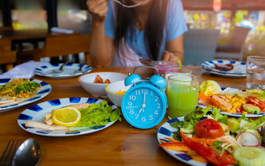 Alarm clock with IF (Intermittent Fasting) 16 and 8 diet rule and weight loss concept.-Diet plan concept