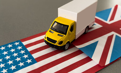 Miniature toy. There is american flag, toy of truck.