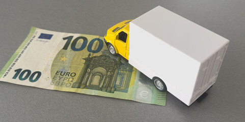 The truck on euro bills. Concept of an insurance contract for new trucks or expensive fuel