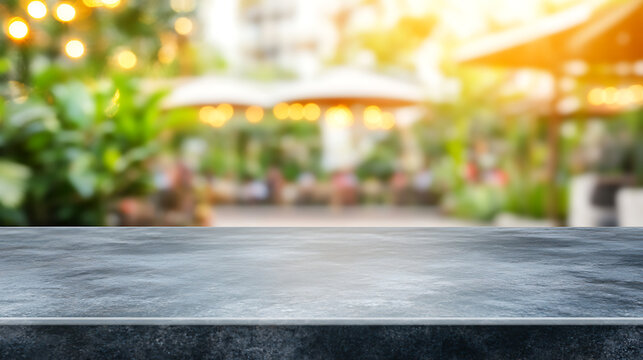 Gray stone countertop surface with blurred outdoor restaurant patio background