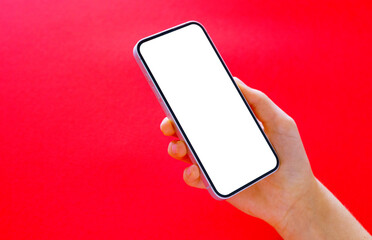 Phone with empty screen in hand, mockup on red background