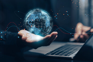 Global network and digital connection: A businessman's hand holds a glowing holographic globe above...
