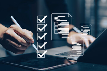 Digital document management and workflow automation: A hand uses a stylus on a tablet, with a...