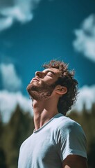 Young Man Enjoys Fresh Air, Eyes Closed in Deep Relaxation and Peace, Connecting with Nature
