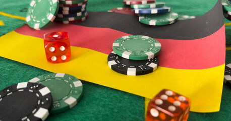 Chips from casino. germany flag. Gambling industry in germany. Casino chips are scattered on steel. Gambling business. Casinos. Gambling. Poker, roulette. 