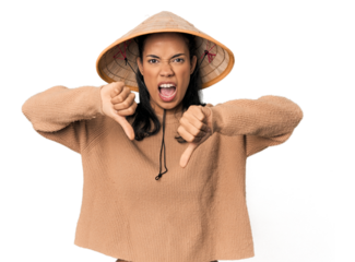 Young Filipina with Vietnamese hat showing thumb down and expressing dislike.