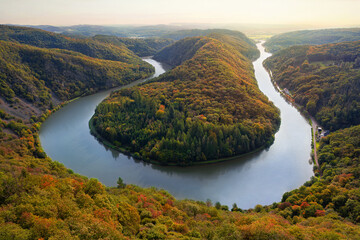 The image shows the Saarschleife near Mettlach (Orscholz, Saarland) in autumn. The river Saar winds...