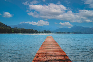 Red wooden bridge over the sea. Travel and Vacation. Freedom Concept