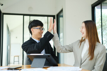 Young business entrepreneurs celebrating a success