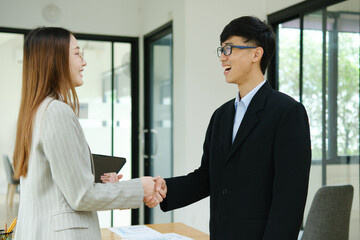 Partnership, teamwork and shaking hands for agreement, consulting or introduction in meeting