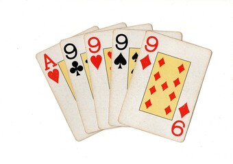 A poker hand of vintage playing cards isolated on a white background.