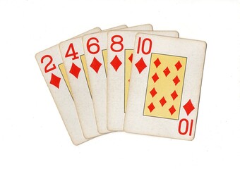 A poker hand of vintage playing cards isolated on a white background.