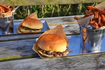 Burgers and sweet potatoes in a bucket, fast food
