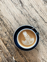 Flat White Coffee with Latte Art on Marble Table. Cafe Still Life.	