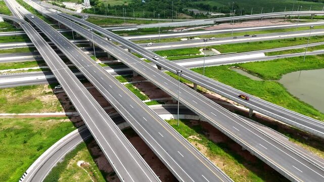 Drone footage of a complex bridge intersection where multiple highway numbers 290 and 304 Nakhon Ratchasima Thailand
