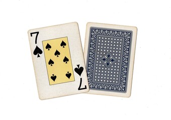 A pair of vintage playing cards with one card revealed on a white background.