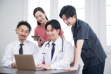 Doctors in brightly lit medical offices and hospitals meeting for check-ins, sharing, meetings, etc. Image of supervisors and residents