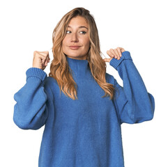 Caucasian blonde woman in studio feels proud and self confident, example to follow.