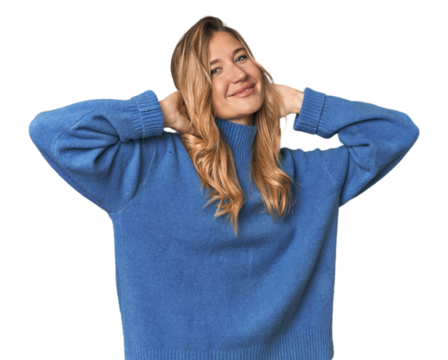 Caucasian blonde woman in studio stretching arms, relaxed position. - Powered by Adobe