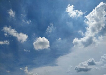 Fluffy Clouds Against Clear Azure
