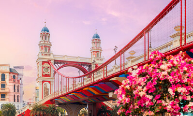 Colorful bridge and towers at sunset in Mega Grand World in Hanoi city town, park Venice, Vietnam