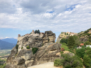 Meteora monasteries in Greece, ancient Orthodox monasteries perch atop towering rock formations. UNESCO World Heritage site, stunning panoramic view. Greek history. A must-see travel destination.