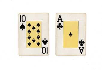 A blackjack or pontoon hand of vintage playing cards on a white, background.