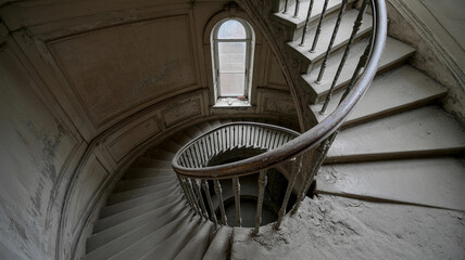 Fototapeta premium Spiral staircase with a window in the middle