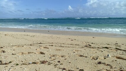 Tranquil Beach Scene with Intricate Sand Patterns