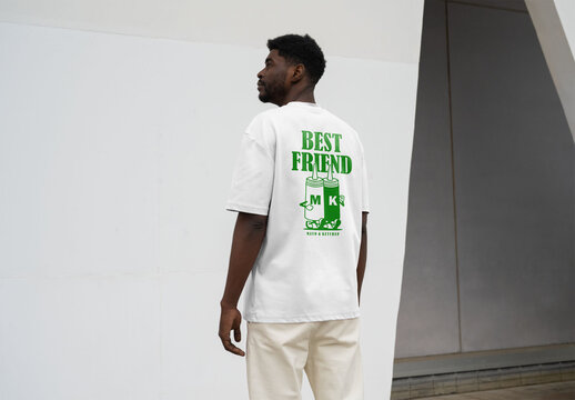 Mockup Of Man Dressed In Customized T-Shirt, Rear View