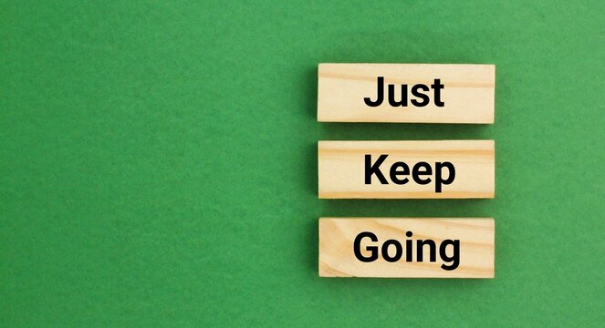 Inspirational and motivational words or quotes Just keep going. self development or self improvement. like a mantra, emphasizes perseverance and the importance of not giving up when facing difficultie