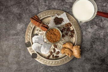 Spices for Indian masala chai tea on a metal try