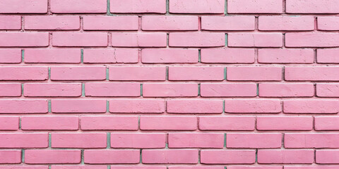 Obraz premium Weathered pink brick wall with varied texture and natural aging, displaying subtle color variations and traditional masonry construction with standard mortar.