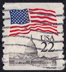 Flag of United States over Capitol on a 1985 USA postage stamp