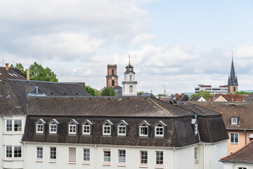 A city skyline in Saarbrucken Germany with a large tower in the middle