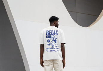 Mockup Of Man Dressed In Customizable T-Shirt, Rear View